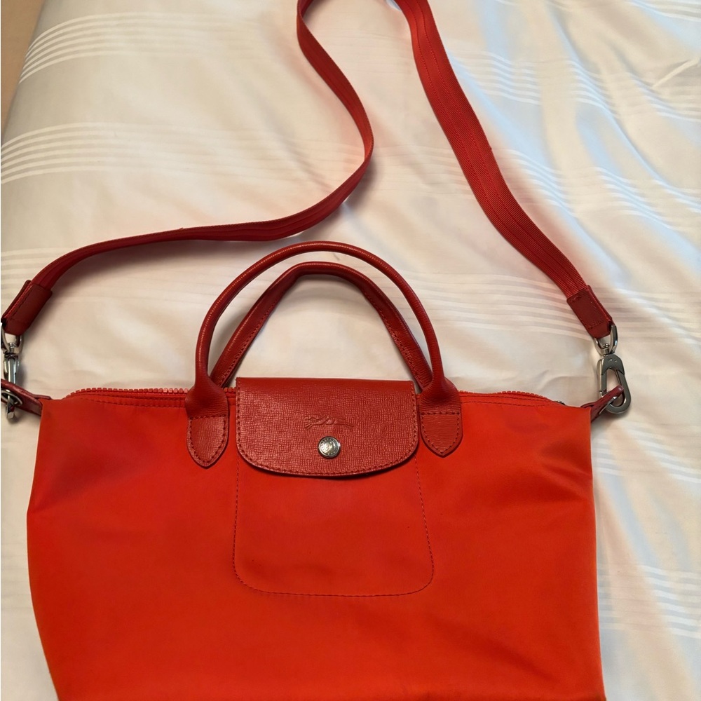 Covid coral/orange with detachable strap. VERY good condition.